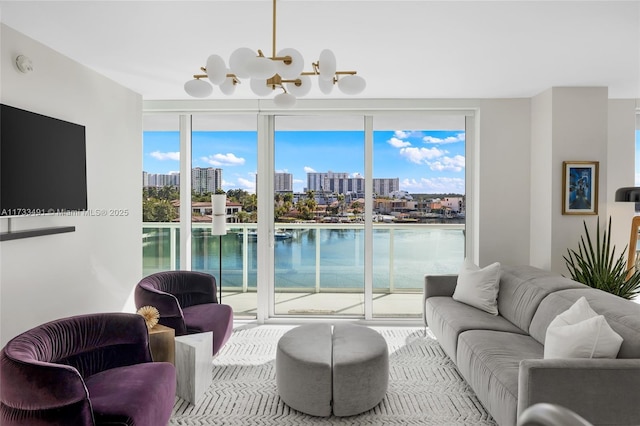 living room with a water view and expansive windows