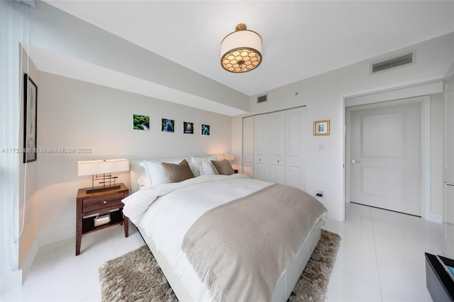 bedroom with light tile patterned flooring