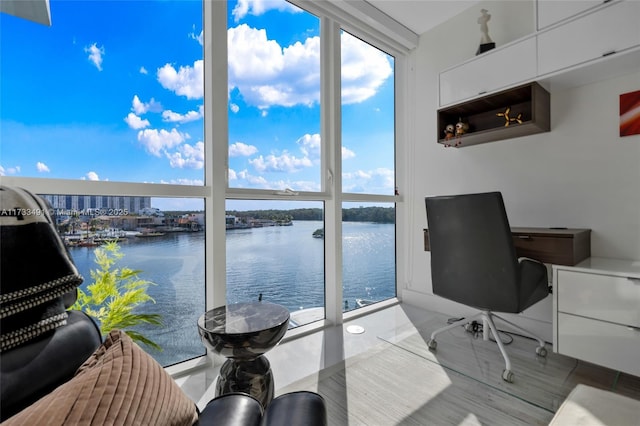 office area featuring a water view and expansive windows