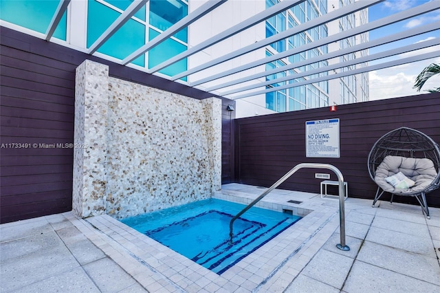 view of swimming pool featuring a patio