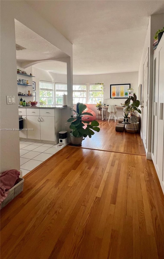 hall with light hardwood / wood-style flooring