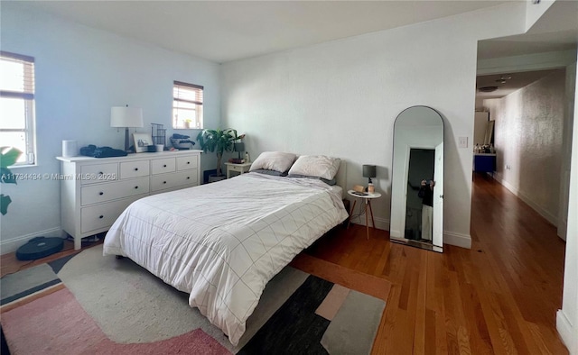 bedroom featuring dark wood-type flooring