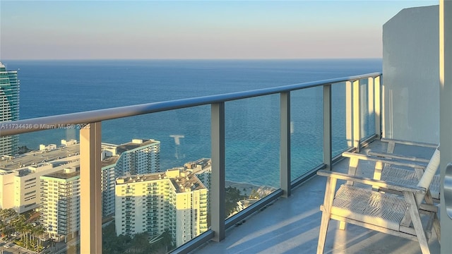 balcony featuring a water view