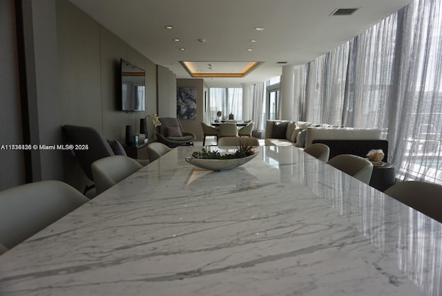 dining area featuring a tray ceiling