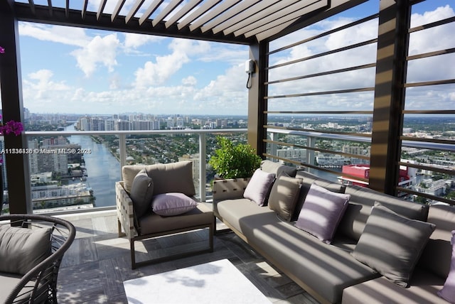 view of patio featuring a balcony and a water view