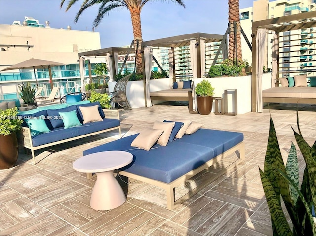 view of patio featuring outdoor lounge area and a pergola