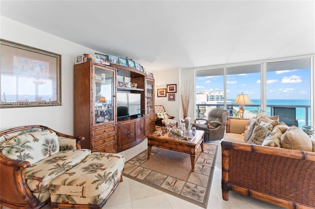 living room with light tile patterned flooring and floor to ceiling windows