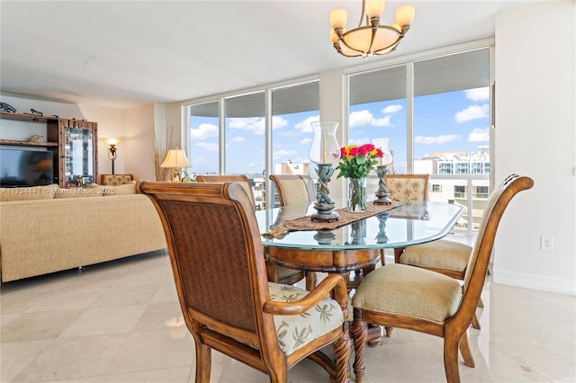 dining area featuring a notable chandelier, light tile patterned floors, a wealth of natural light, and expansive windows