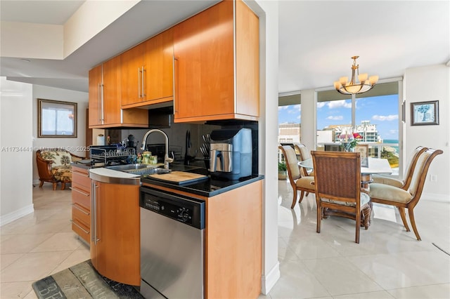 kitchen featuring decorative light fixtures, a chandelier, light tile patterned floors, stainless steel dishwasher, and decorative backsplash