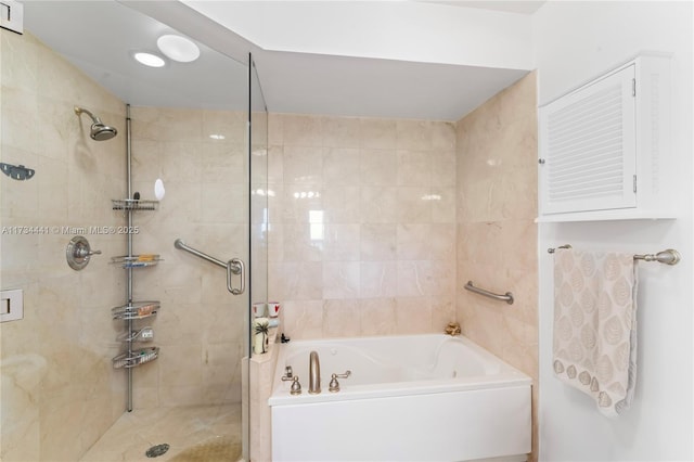 bathroom with shower with separate bathtub