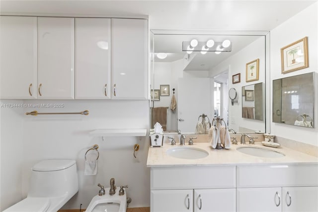 bathroom with a bidet, vanity, and a shower with shower door