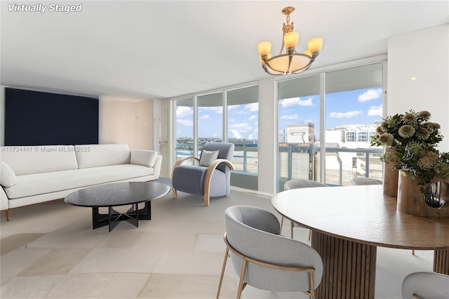 6365 Collins Ave Unit 1901, Miami Beach, FL 33141 - dining area featuring a chandelier and a water view