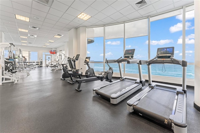 6365 Collins Ave Unit 1901, Miami Beach, FL 33141 - gym with a paneled ceiling and a wall of windows