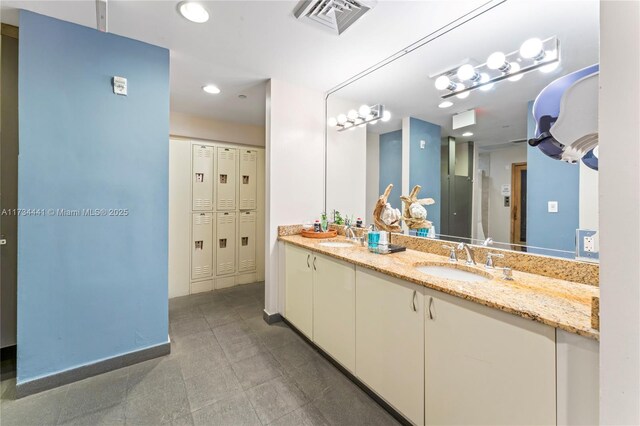 6365 Collins Ave Unit 1901, Miami Beach, FL 33141 - bathroom featuring double vanity and recessed lighting