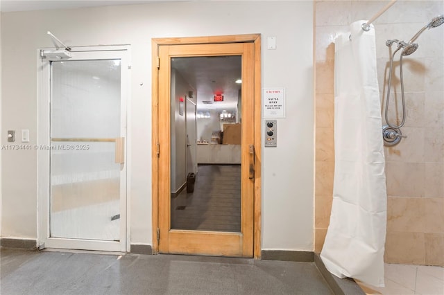 bathroom featuring a shower with curtain