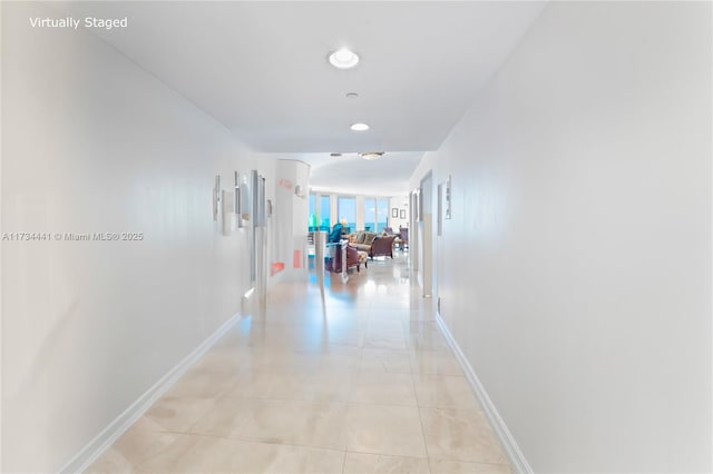 hallway with light tile patterned flooring