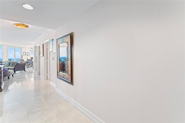 corridor with light tile patterned floors