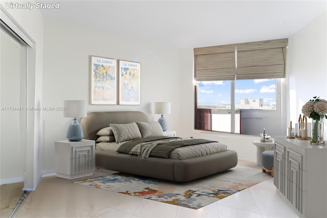 bedroom featuring light tile patterned floors