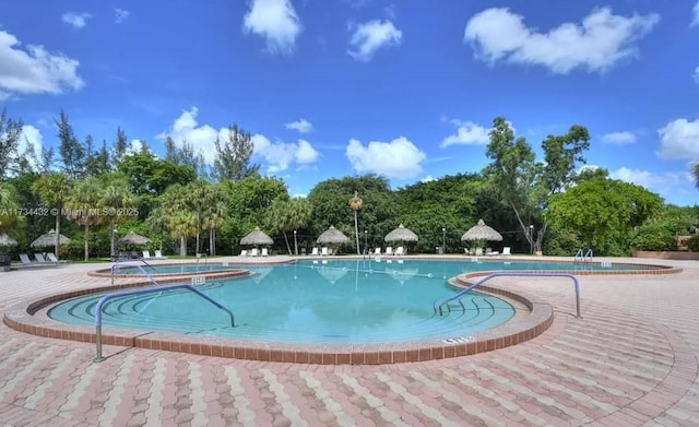 community pool with a patio area