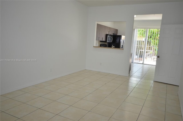 view of tiled spare room