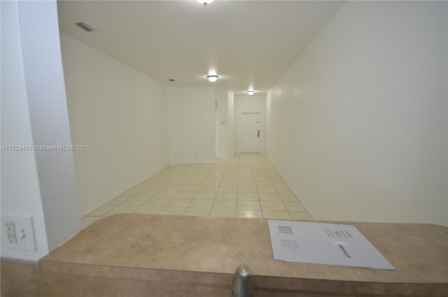 interior space with light tile patterned floors