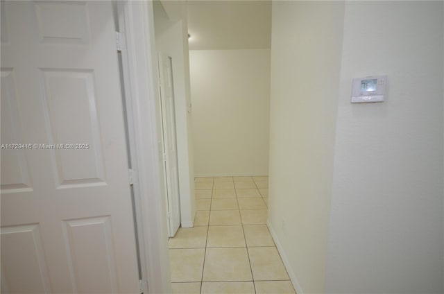 hallway featuring light tile patterned flooring