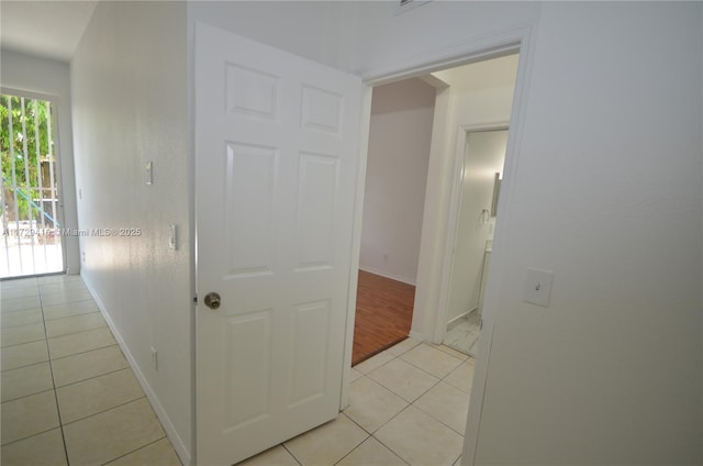 hallway with light tile patterned flooring