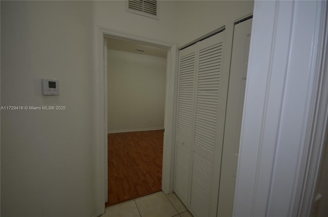 hallway with light tile patterned floors