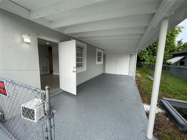 view of patio / terrace with a carport