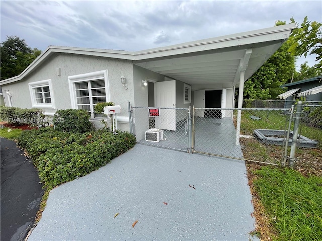 view of front of home featuring a carport