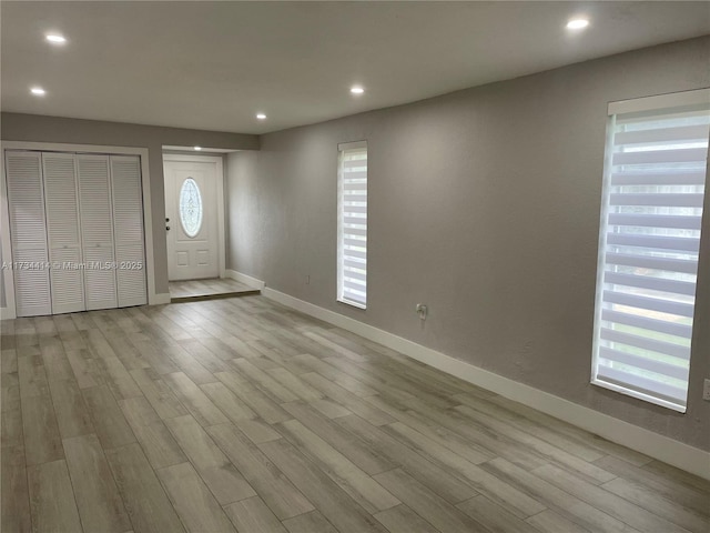 entryway with light hardwood / wood-style flooring