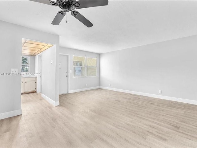 unfurnished room featuring ceiling fan and light hardwood / wood-style floors