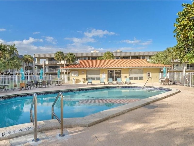 view of swimming pool with a patio area