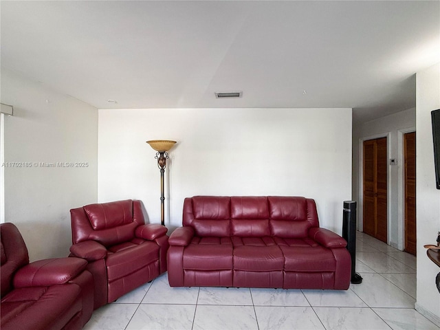 living room with light tile patterned floors