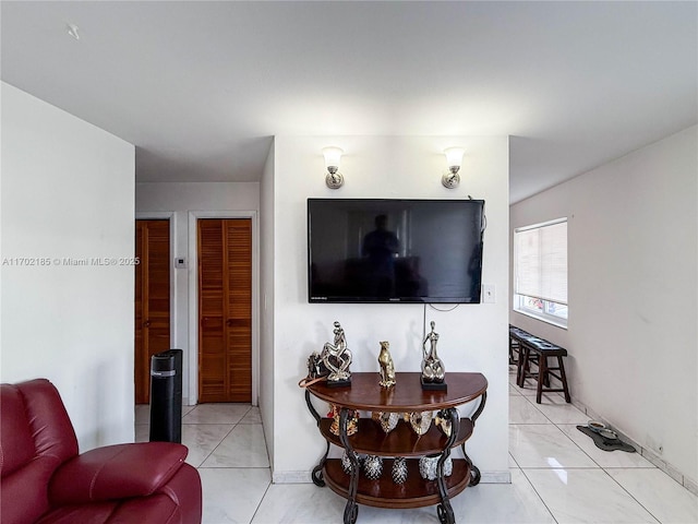 living room with light tile patterned floors