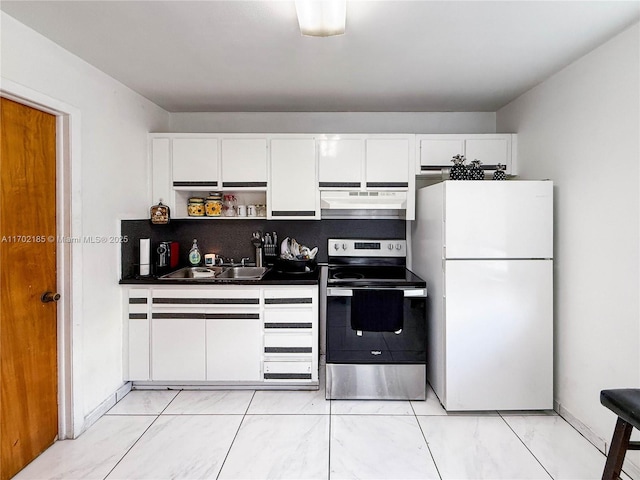 kitchen featuring electric stove, white cabinetry, sink, and white fridge