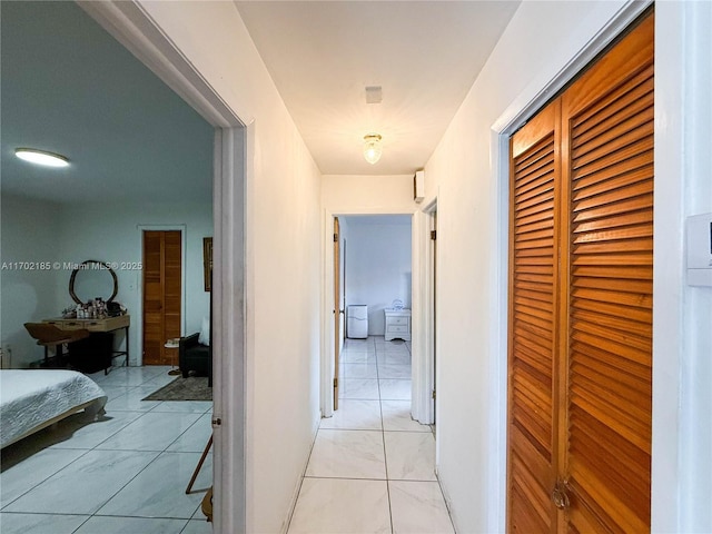 hallway with light tile patterned floors