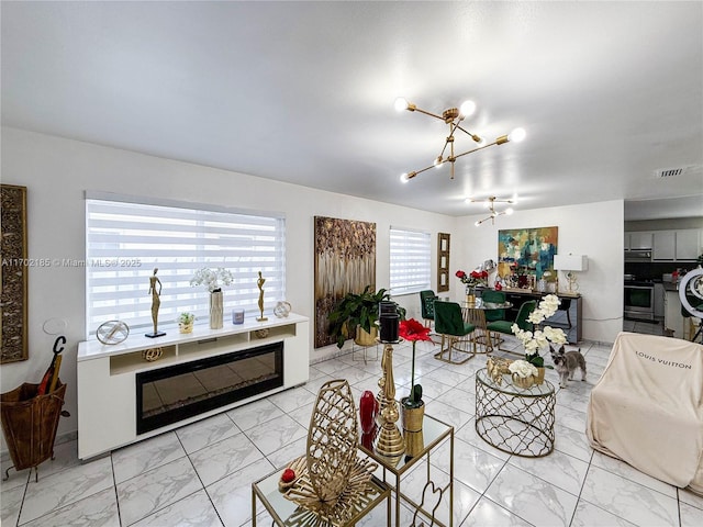 living room featuring an inviting chandelier