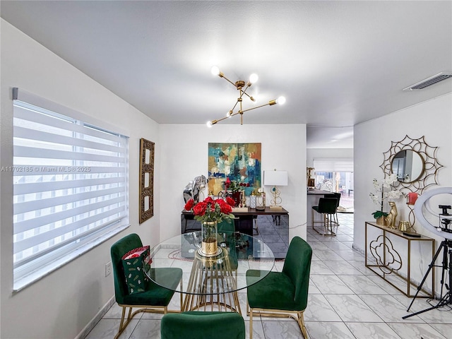 dining space featuring a chandelier