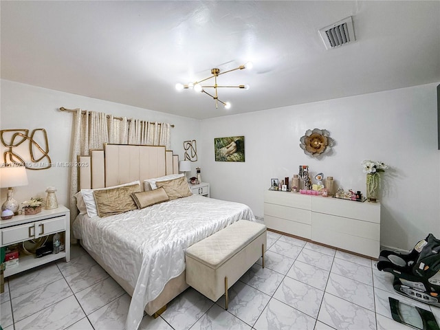 bedroom with an inviting chandelier