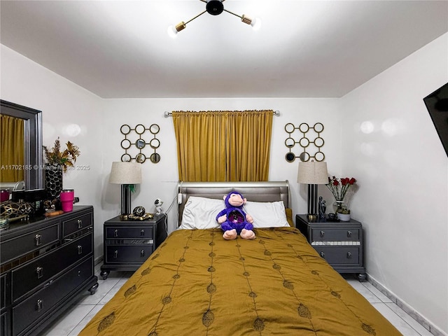 bedroom featuring light tile patterned floors