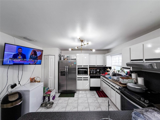 kitchen featuring decorative backsplash, sink, white cabinets, and black appliances