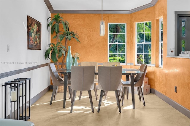 dining area with crown molding