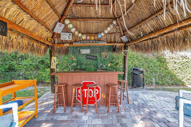 view of patio / terrace with a gazebo and exterior bar