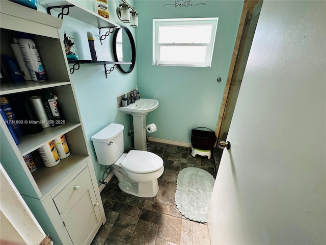 bathroom featuring sink and toilet