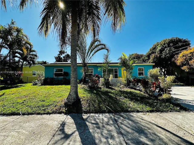 ranch-style house with a front yard