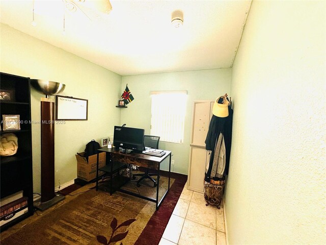 hall featuring electric panel and light tile patterned flooring