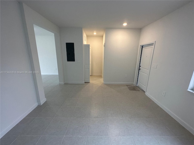 spare room with light tile patterned flooring and electric panel