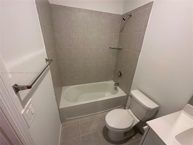 full bathroom with vanity, tile patterned floors, toilet, and tiled shower / bath