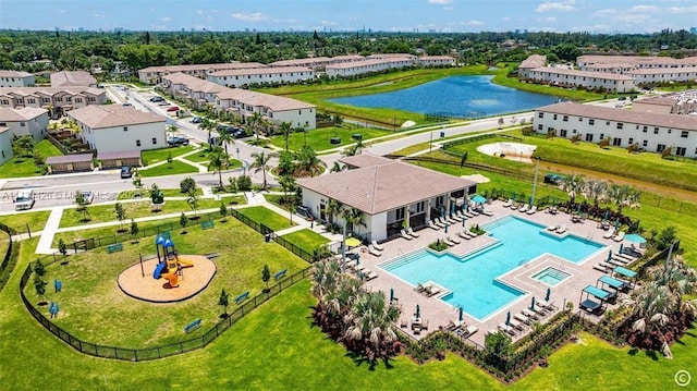 birds eye view of property with a water view